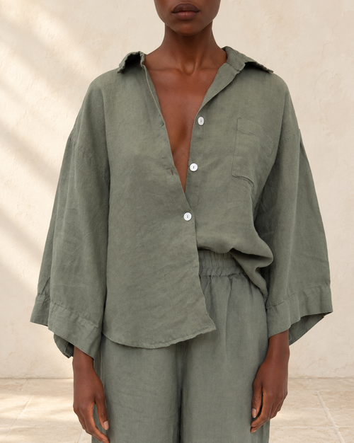 Agnes Linen Top styled against warm ivory plaster and limestone
