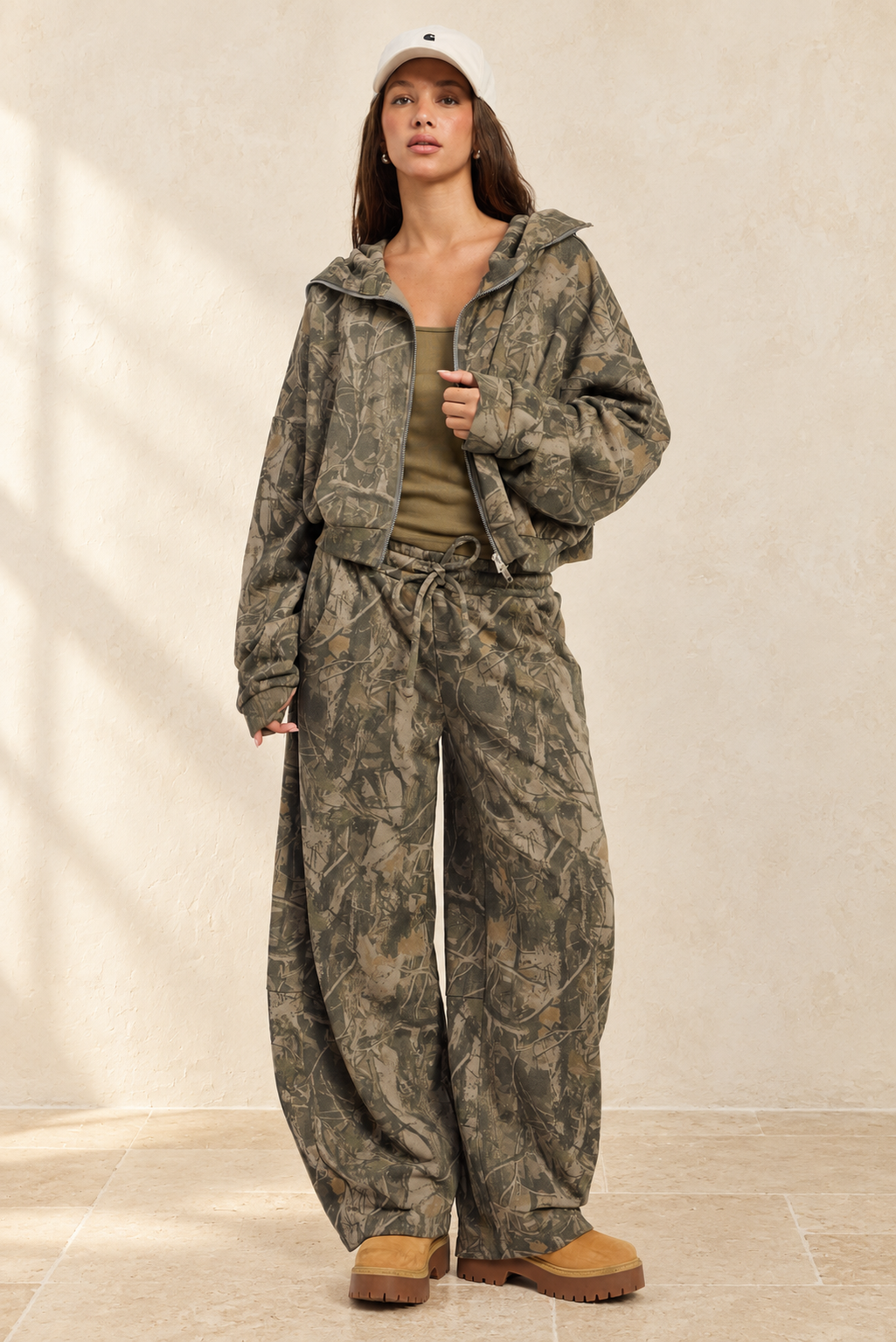 Alina Pants styled against warm ivory plaster and limestone