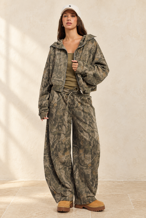 Alina Pants styled against warm ivory plaster and limestone