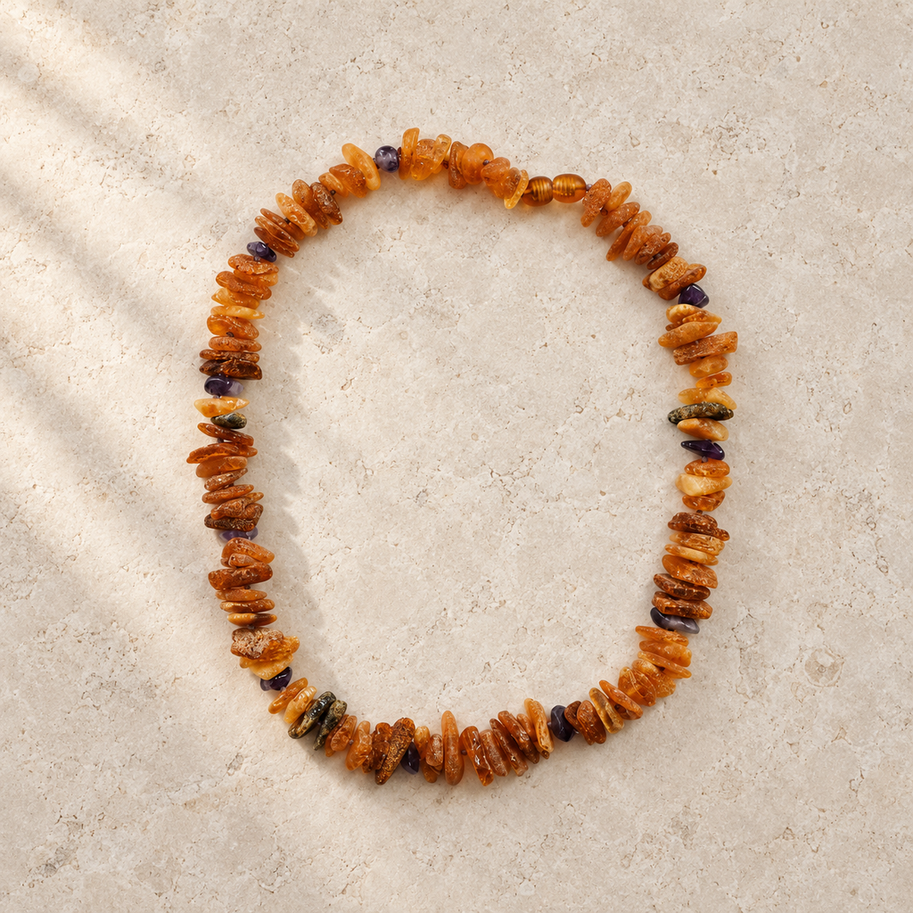 Baltic Amber + Amethyst Pet Necklace styled on a warm ivory and limestone Oak & Row backdrop