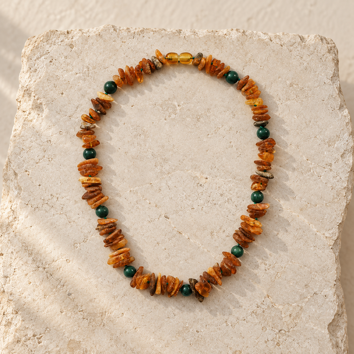 Baltic Amber + Green Jade Pet Necklace styled on a warm ivory and limestone Oak & Row backdrop