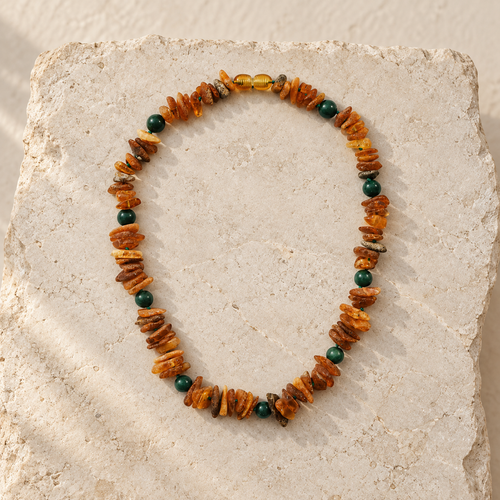 Baltic Amber + Green Jade Pet Necklace styled on a warm ivory and limestone Oak & Row backdrop