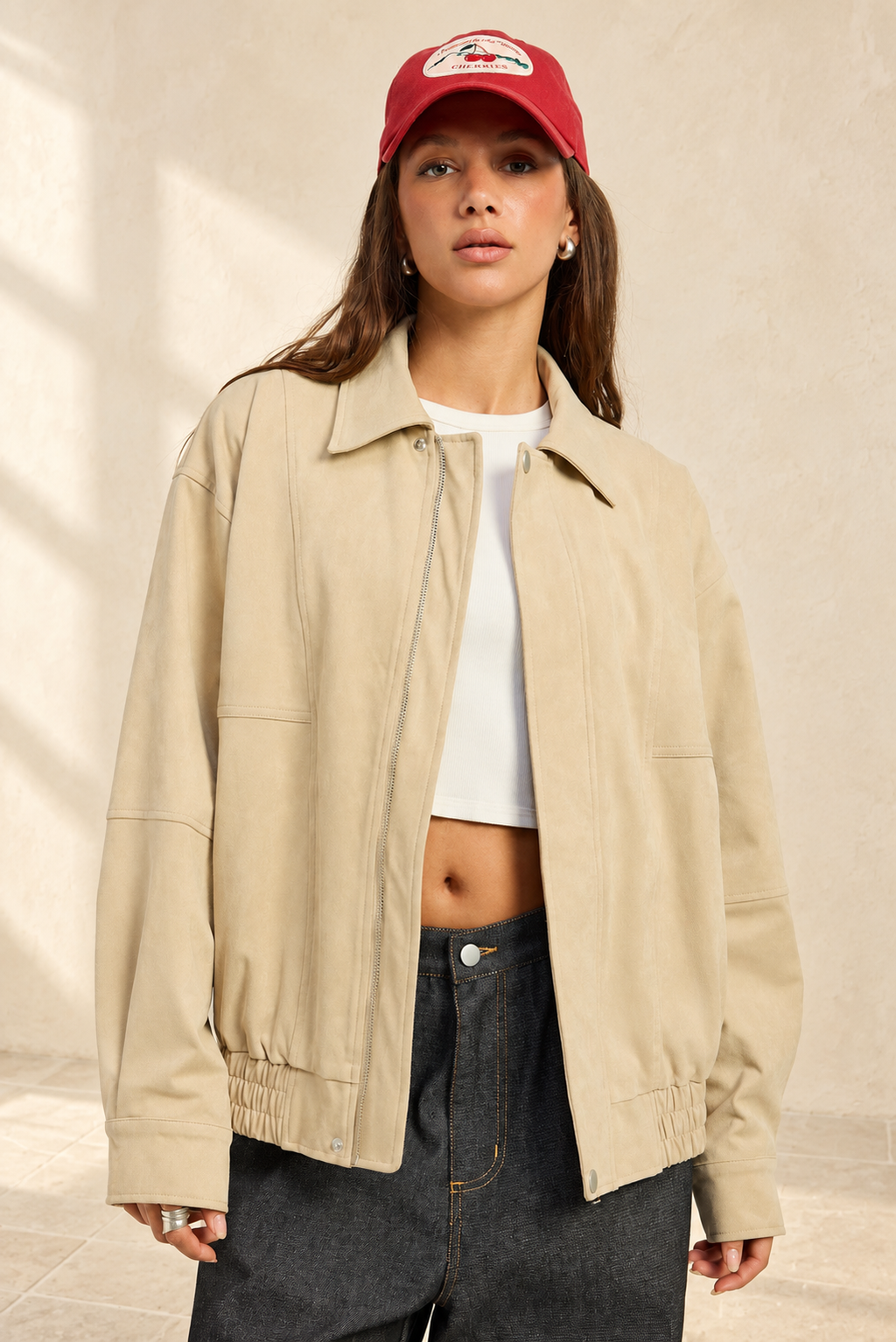 Journey Bomber Jacket styled against warm ivory plaster and limestone