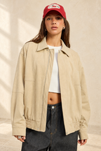 Journey Bomber Jacket styled against warm ivory plaster and limestone