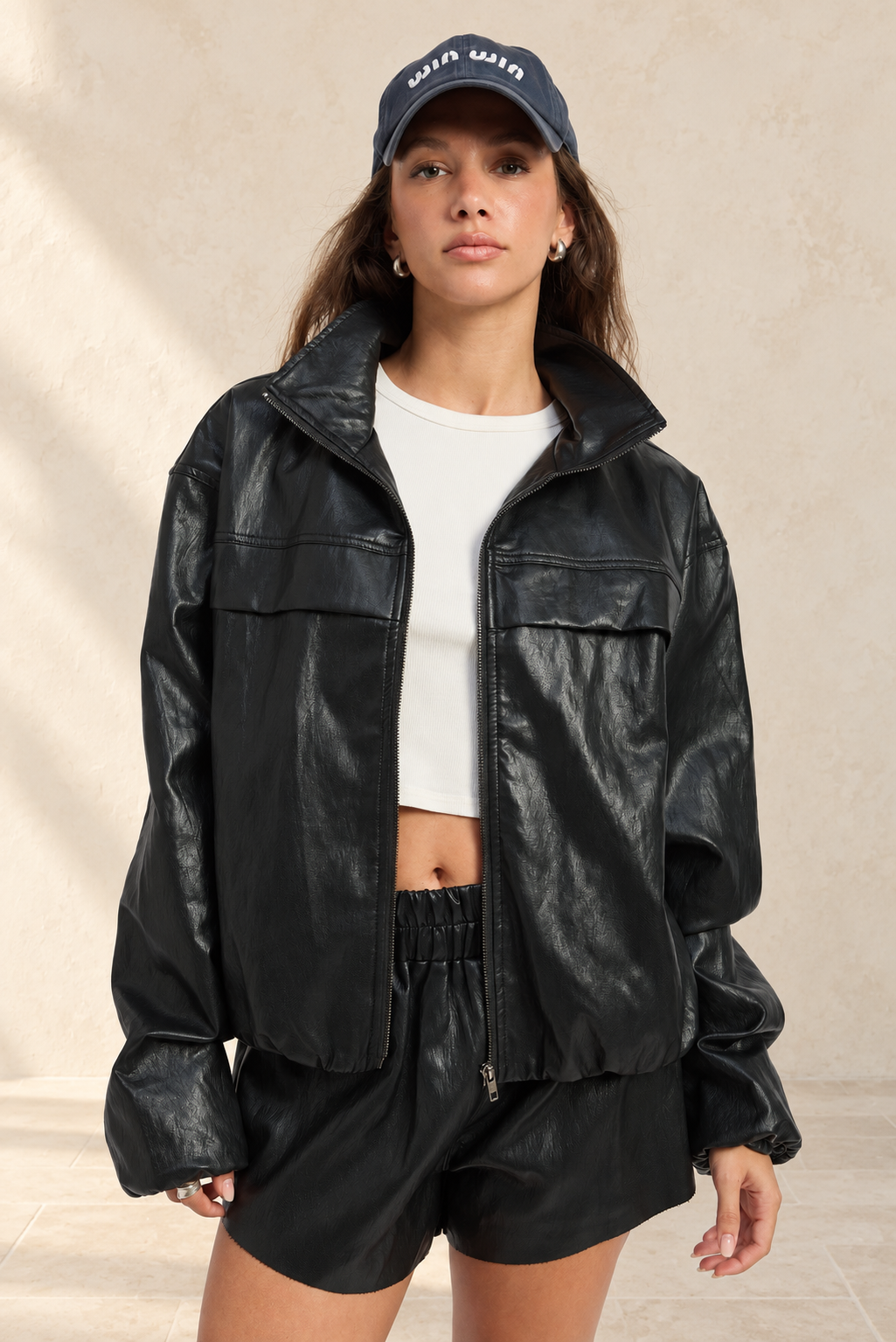 Nora Jacket styled against warm ivory plaster and limestone